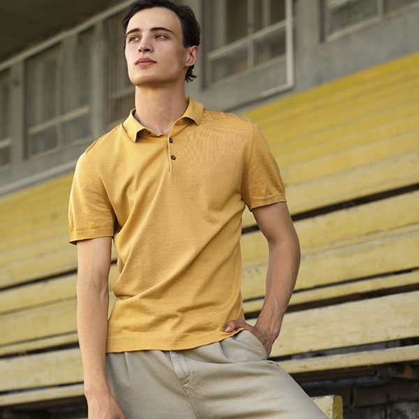 a guy wearing a mustard coloured shirt
